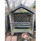 A FOREST GARDEN WOODEN ARBOUR SEAT, REPAIR REQUIRED,