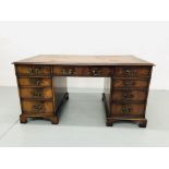 A REPRODUCTION MAHOGANY TWIN PEDESTAL NINE DRAWER DESK WITH INSET LEATHER TOP,