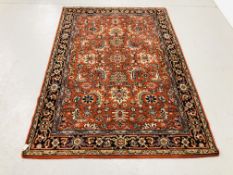 AN ORANGE/BLUE KASAK EASTERN DESIGN RUG, 2.16M X 1.