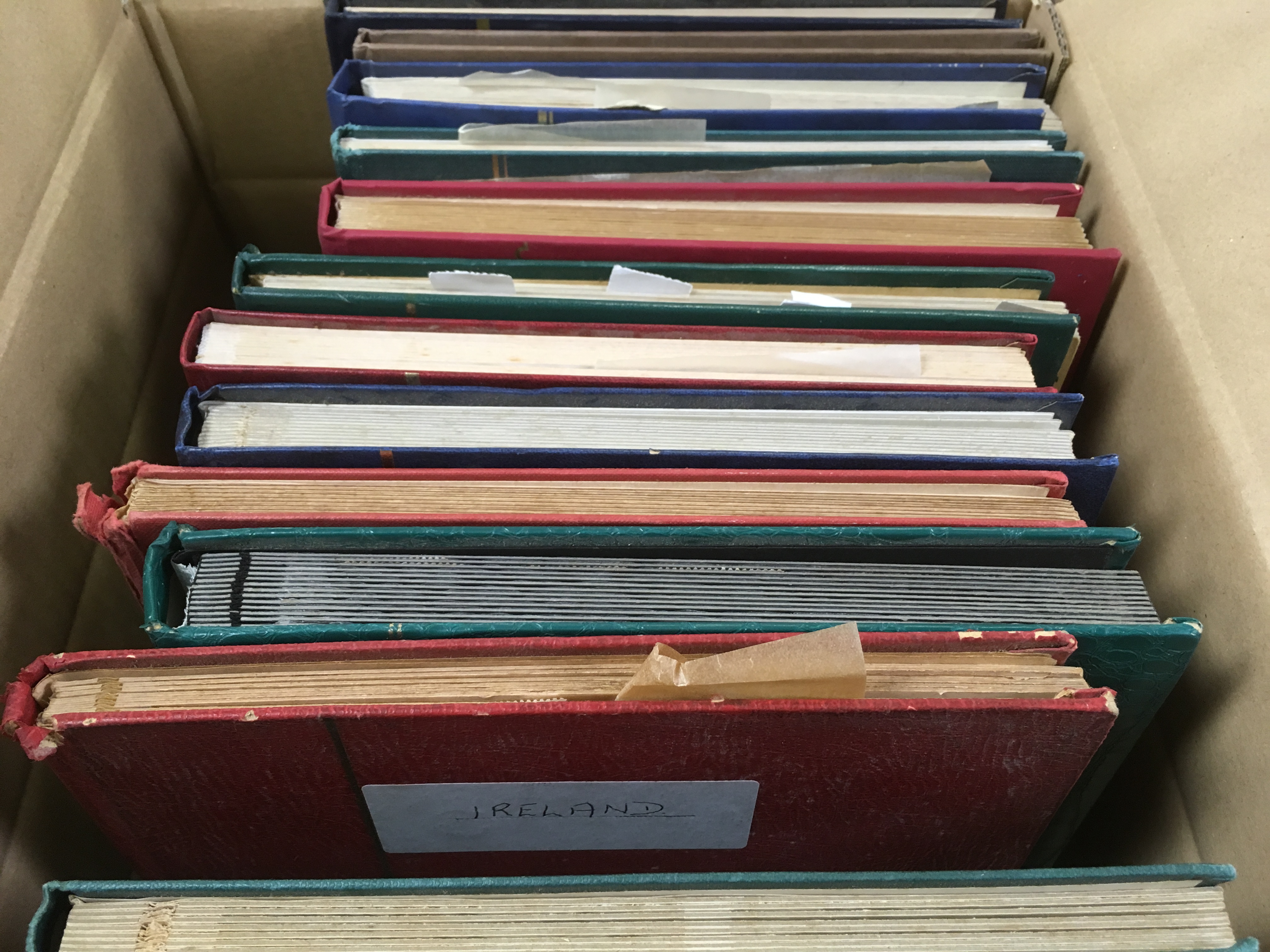 BOX OF VARIOUS IN THIRTEEN STOCKBOOKS, E