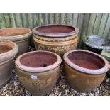 A PAIR OF TERRACOTTA PLANTERS DECORATED WITH DRAGONS AND 1 LARGER MATCHING PLANTER