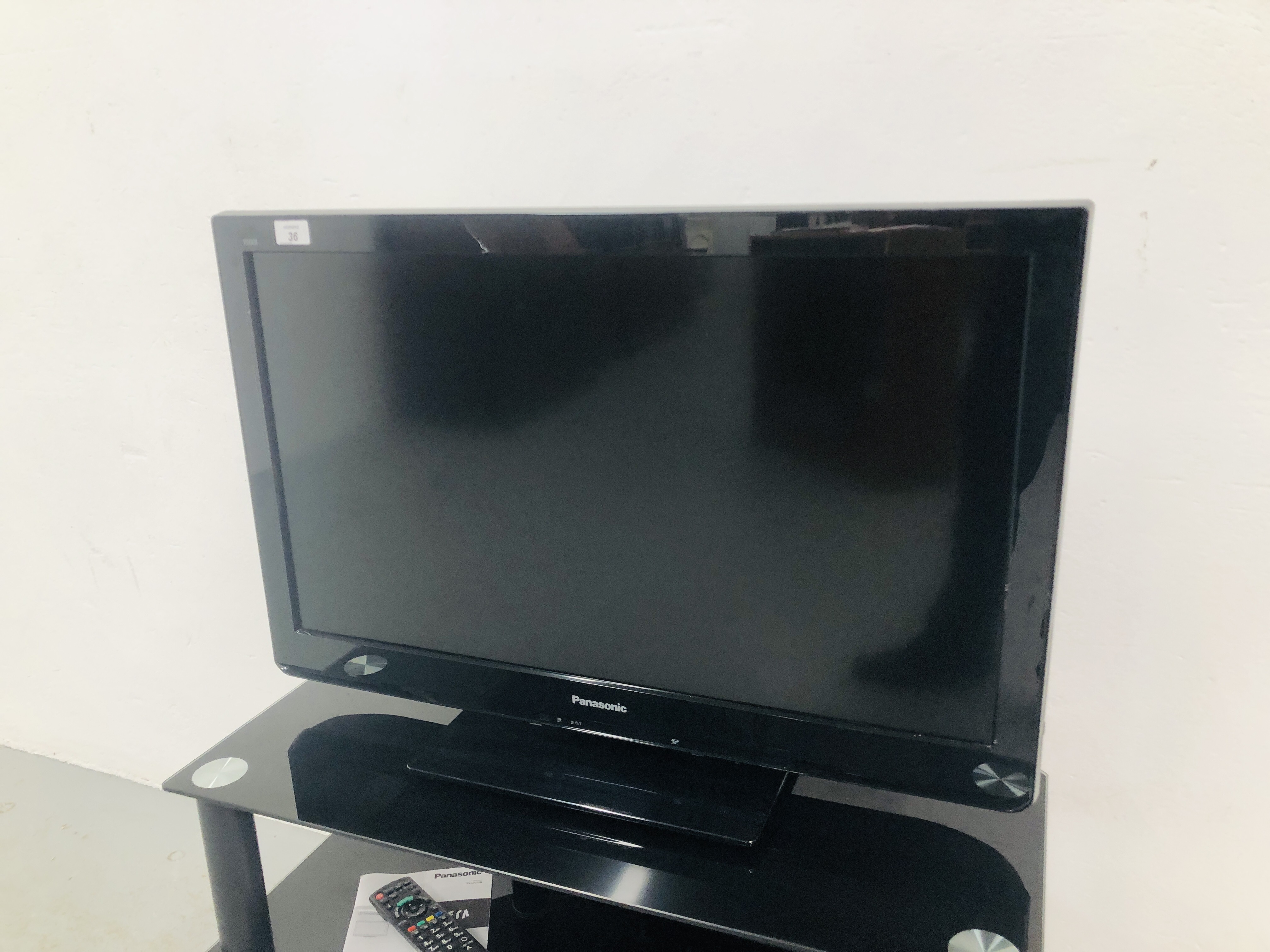 PANASONIC 39 INCH TV MODEL TX - L32 C3B WITH REMOTE TOGETHER WITH A MODERN BLACK GLASS 3 TIER STAND - Image 2 of 6