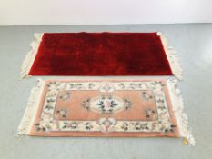 A QUALITY CRIMSON RED RUG WITH SHADOW PRINT DESIGN. L 155CM. W 77CM. AND A CHINESE DEEP PILE RUG.