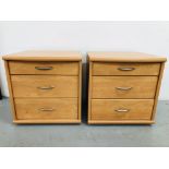 A PAIR OF MODERN CHERRY WOOD EFFECT FINISH THREE DRAWER BEDSIDE CHESTS (ONE DRAWER REQUIRES