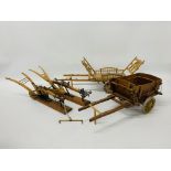TWO WELL DETAILED AND HAND CRAFTED WOODEN MODELS OF "HAY CARTS" AND TWO HAND CRAFTED WOODEN PLOUGH