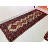 A HAMADAN RED/BLUE PATTERNED CARPET RUNNER 2.9 x 1.05. 1.