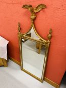 A REPRODUCTION GILT FINISH WALL MIRROR SURMOUNTED WITH EAGLE DESIGN