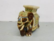 A GLAZED AND DECORATED POTTERY ELEPHANT SEAT HEIGHT 43cm