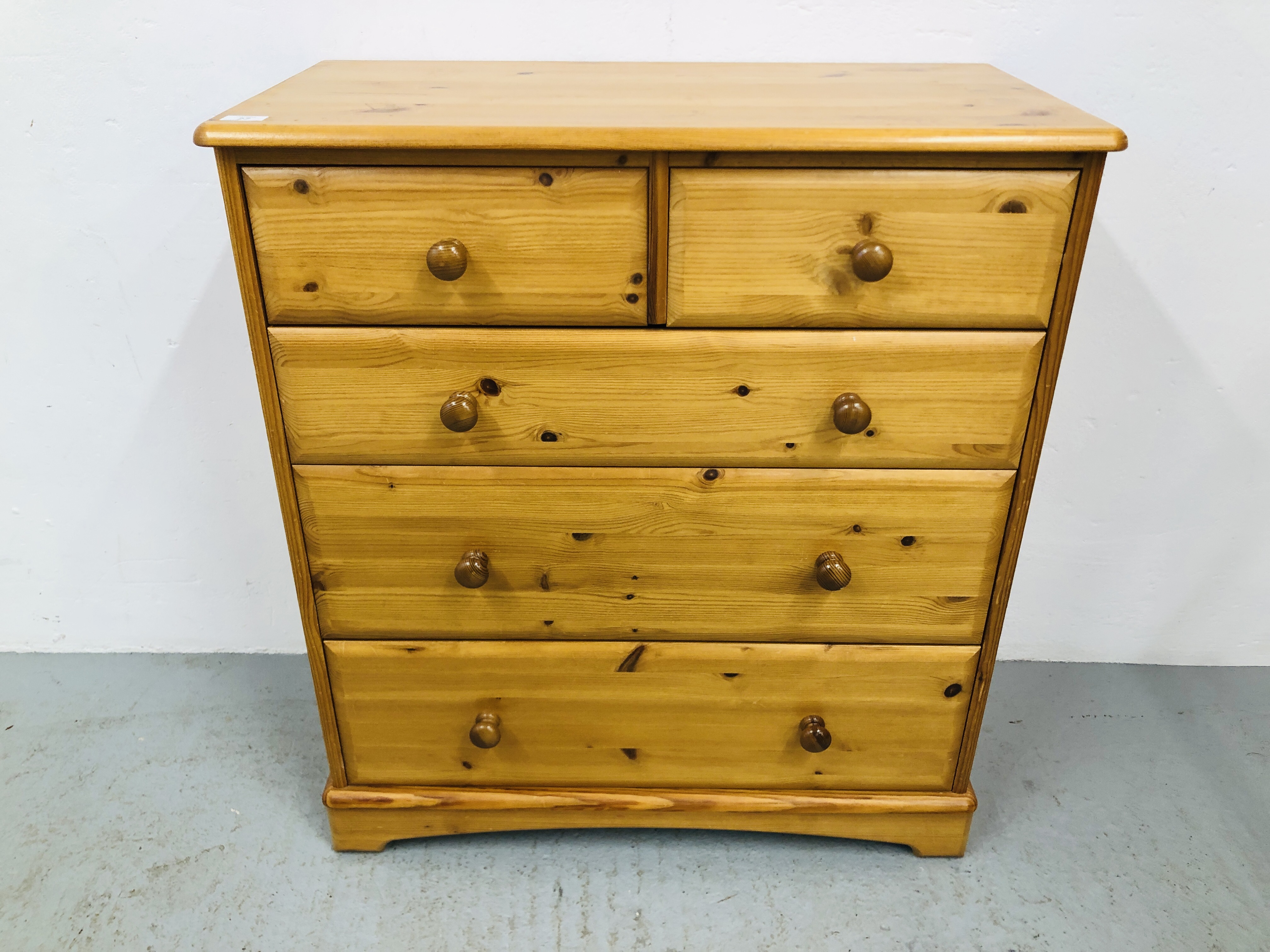 A HONEY PINE TWO OVER THREE CHEST OF DRAWERS WIDTH 83CM. HEIGHT 9CM. DEPTH 41CM.