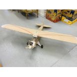 A LARGE MODEL RADIO CONTROLLED AIRCRAFT FITTED WTIH ENGINE (MAY REQUIRE ATTENTION)