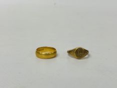 A 22CT. GOLD WEDDING BAND AND A 9CT.
