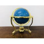 A POLISHED GEMSTONE GLOBE IN GIMBLE MOUNT 8 INCH