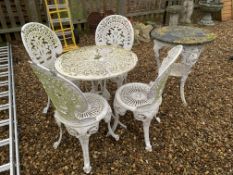 A CAST METAL GARDEN CIRCULAR TABLE AND 4 CHAIRS + 1 OTHER CAST METAL BASE TABLE