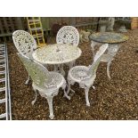 A CAST METAL GARDEN CIRCULAR TABLE AND 4 CHAIRS + 1 OTHER CAST METAL BASE TABLE