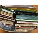 BOX WITH AN EXTENSIVE ACCUMULATION OF STAMPS IN SEVERAL ALBUMS, ON LEAVES ETC, GERMANY, GB,