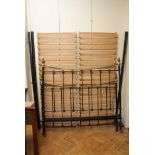 A Victorian style black iron and brass bedstead, with decorative finials, 150cm wide