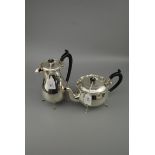 A 1920s silver teapot and hot water jug, Birmingham 1923, 35 troy oz gross weight