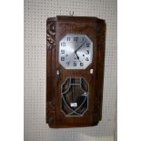 An oak cased Westminster chiming Art Deco wall clock, 67cm long