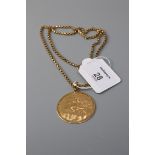 A pendant and chain, the circular pendant engraved with a galleon, commemorative description to