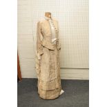 A Victorian ladies beige silk dress, bodice and undertier