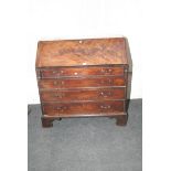 A George III figured mahogany fall front bureau, with fitted interior