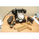 A vintage ebonite dial telephone with drawer bellow, ivory barrelled opera glasses and other items