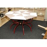 A craftsman made sample marble octagonal table, with wrought iron base, 131cm