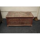 A large painted and decorated Eastern European chest with iron handles, 127cm wide