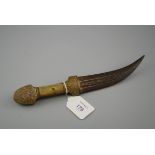 A 19th century camel bone handled jambiya, with engraved iron blade, 24.5cm overall