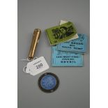 A gold cheroot holder, an enamel and silver St Christopher plaque and three pre-decimal books of