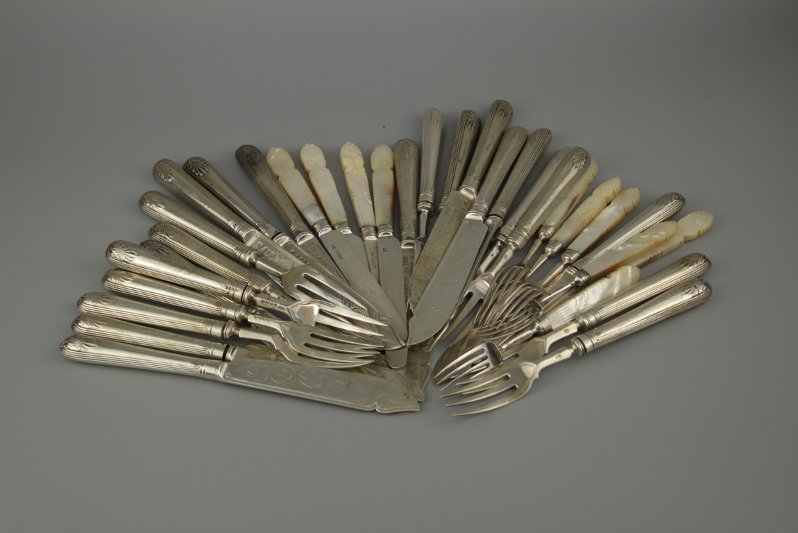 A matched part set of silver fish knives and forks, comprising 11 knives and forks, London 1882