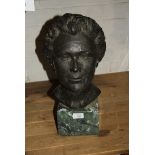 Louisa Bolins? A green patinated cast bronze bust study of a mature lady on a green marble plinth,