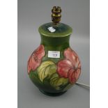 A Walter Moorcroft moss green ground pink poppy pattern baluster table lamp, bearing puce painted '