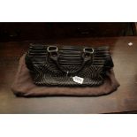 A Celine boogie bag, stitched leather brown with brass hardware and dust bag
