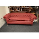 A Victorian three seat 'Chesterfield' settee with bun feet, 220cm wide