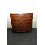 A George IV ebony strung mahogany bow front chest, of two short over four long drawers on turned