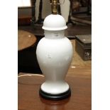 A 20th century Chinese Qing Bai glazed porcelain table lamp and cover, on a hard wood socle, 39cm