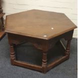 A 17th century style oak coffee table with octagonal top and turned supports, 80cm wide