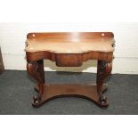 A Victorian serpentine fronted mahogany washstand, 106cm