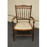 An Edwardian inlaid mahogany open armchair, with shaped arms