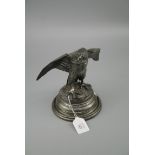 A Victorian silver plated ink well, in the form of a spread eagle on a rock base, 19cm wide