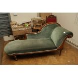 A late Victorian walnut framed scroll end chaise longue, with turned supports, 200cm