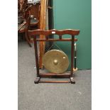 A Chinese hardwood and bronze gong in stand with hide covered donger, 80cm high