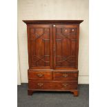 A George III mahogany drop waist linen press, the upper section with applied astragal moulding to