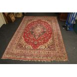 An Indian cotton pile carpet with geometric central lozenge design, 225 x 330cm