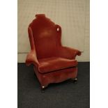 A Queen Anne style scroll arm wing chair, with shaped back