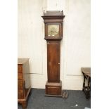 An 18th century oak cased 8-day longcase clock, the brass dial marked for Woolley of Kington,