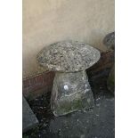 A 19th century Rustic hewn gritstone staddle stone base and cap, approximately 67cm high