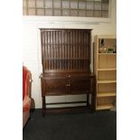 A 1920s oak cupboard dresser and rack, 122cm wide