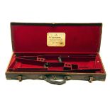 W. RICHARDS A BRASS-CORNERED LEATHER DOUBLE GUNCASE, fitted for 30in. barrels, the interior lined